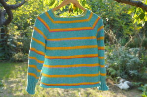 Hand knit top down raglan sweater with cotton yarn.