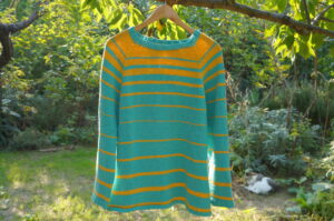 Hand knit top down raglan sweater for men.