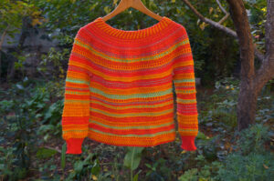 Handknit wool sweater with brioche and tuck stitches to create textures
